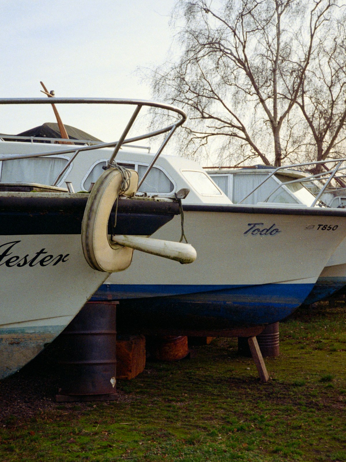 Rows of boats stored on land out of the water